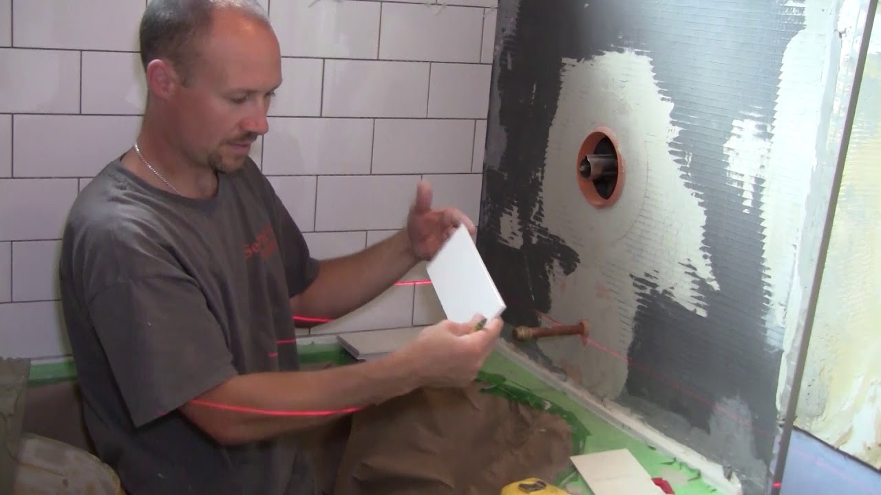 How to Tile a Bathroom 34: Tiling the First Row - YouTube