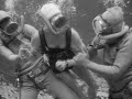 Vintage scuba diving woman diver gets captured 1950s