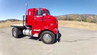 1959 GMC DETROIT DIESEL HOOD OPEN SHOWING MECHANICALS OF TRUCK AND DRIVING OVER CAMERA