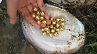 A pile of gold beads was found in a creek ditch.