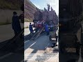 Process of electric tricycle loading and unloading from the truck