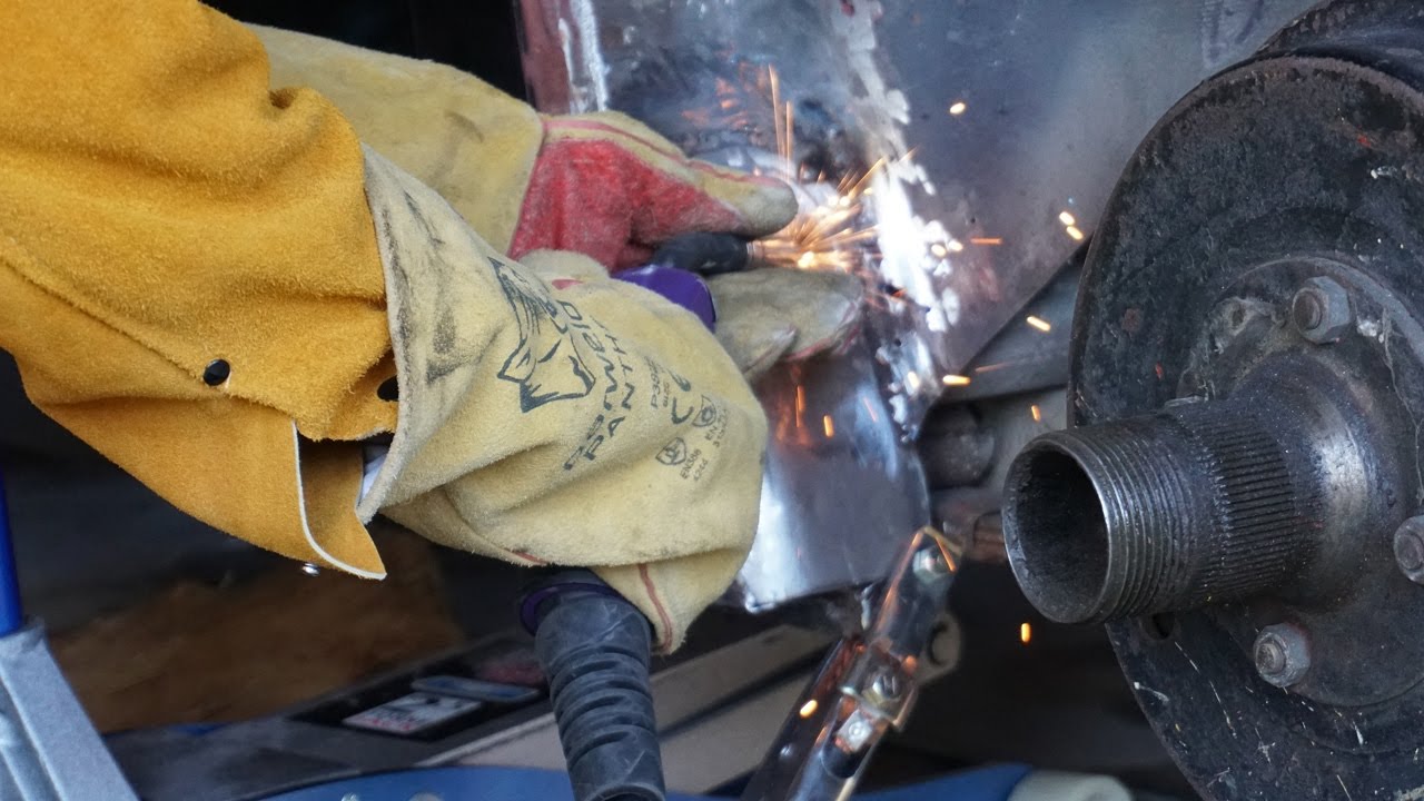 TR3A welding patches and try fitting rear quarter panel YouTube