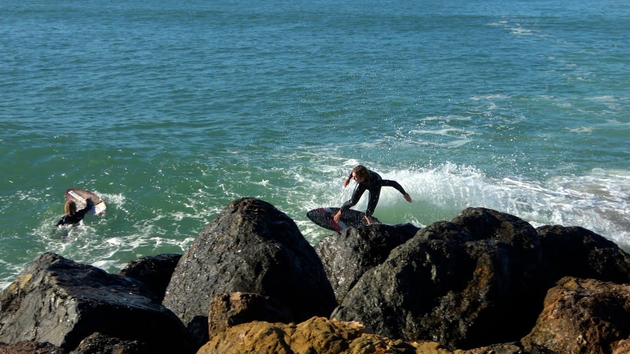 RAW: Skimboarders Catch Rare Wave Around Jetty