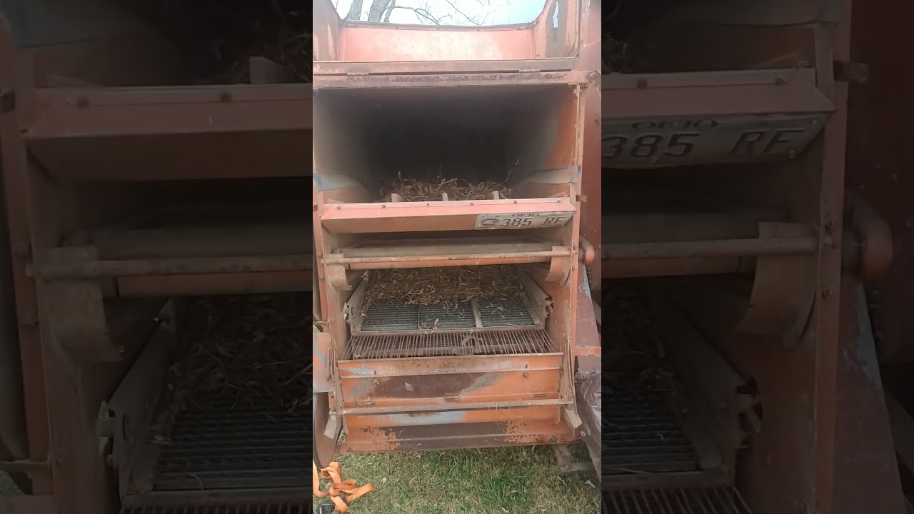 Inside an Allis Chalmers All Crop 60 running soybeans.