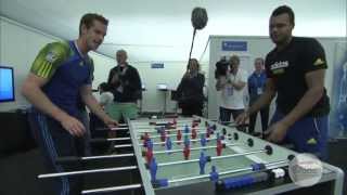 Andy Murray and Jo-Wilfried Tsonga play table football during the Aegon Championships