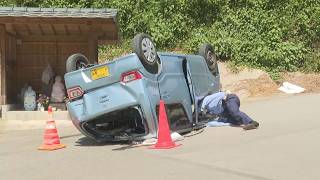 Car plunges from cemetery parking lot, 2 seriously injured