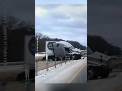 Truck slides through barrier on icy Oklahoma highway