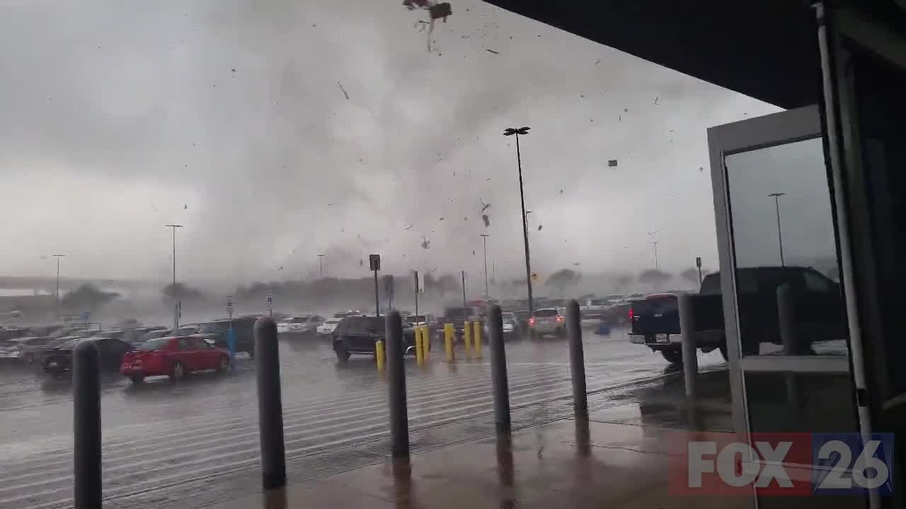 People running from tornado outside Walmart in central Texas