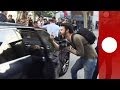 Protesters attack Spanish finance minister's car in Barcelona after political rally