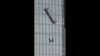 2 window washers seen hanging on side of high-rise building during rescue in Virginia