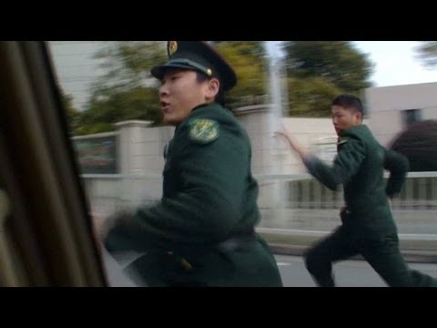 China security officers chase CNN crew