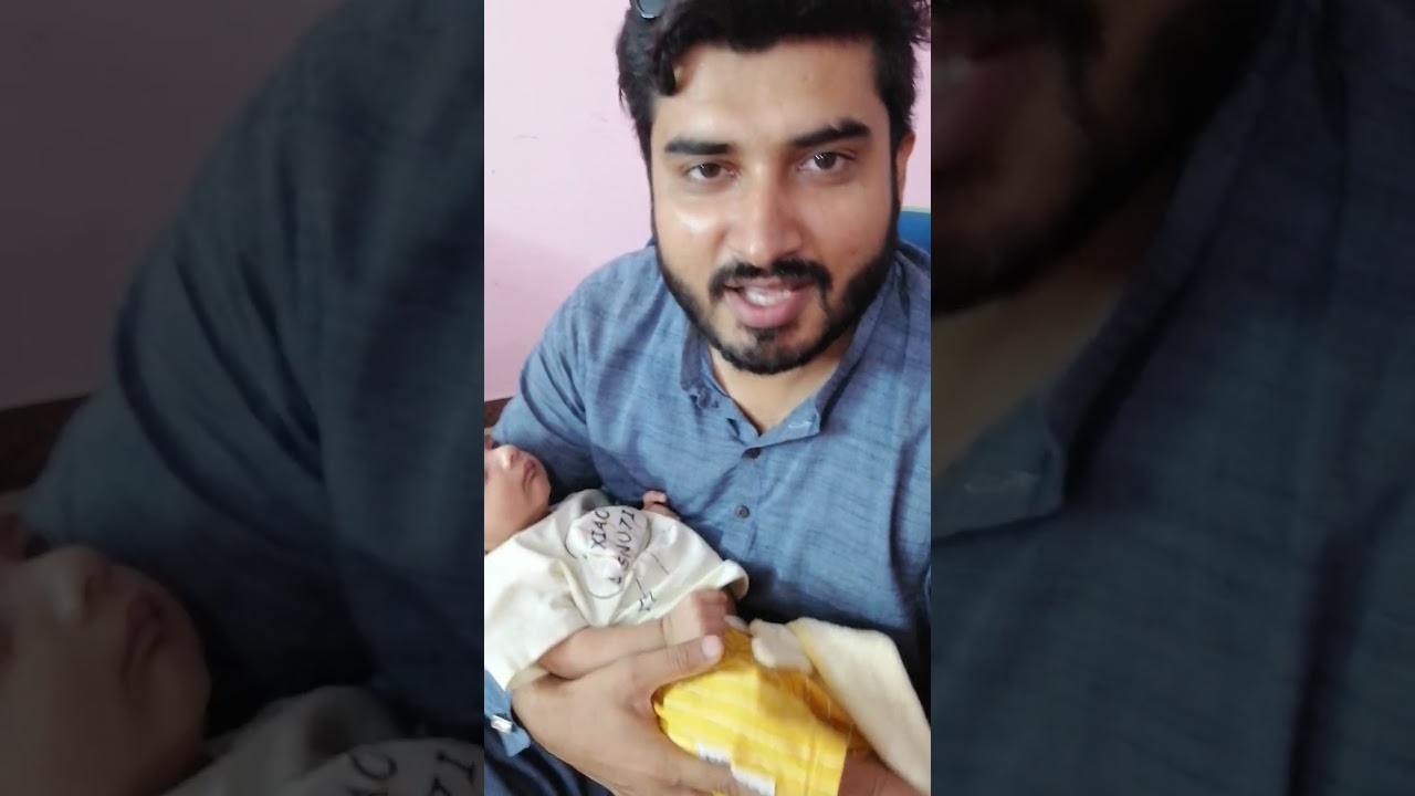 New Born Baby Salaar Kashif is passing his cute smile to his papa 