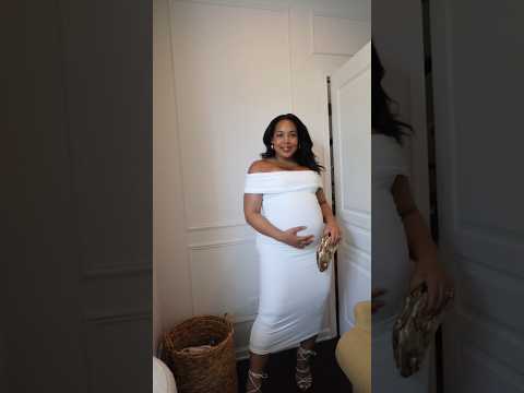 वीडियो: ऑन-ट्रेन्ड फ्लोरल्स में गर्भवती किम्बरले वॉल्श कपड़े बेबी टक्कर
