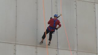 Stanford head coach Jerod Haase supports Outward Bound with 46-story rappel
