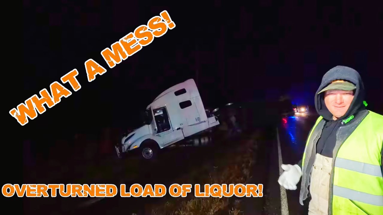 A TRACTOR TRAILER LOAD OF COFFEE LIQUOR TURNED OVER BLOCKING THE ROAD ...