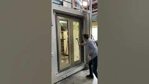 Munitus security double glassing door test with axe.