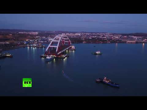 AERIAL: 5,500-ton Crimea Bridge motorway arch sails off for installation op