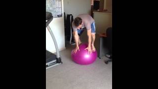 Beginner standing on a stability ball