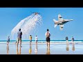 Fighter jets fly low over famous australian beach