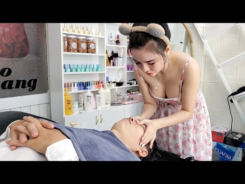 Beautiful girl in a vibrant floral dress, she washes my hair and gives me a wonderful relax