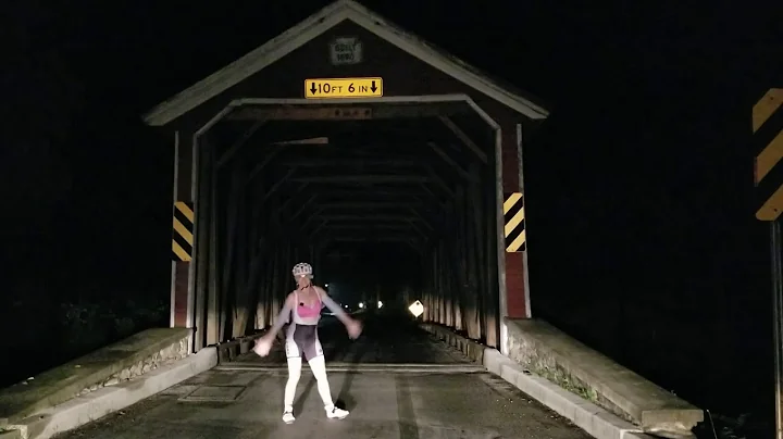 Tiger aka Teresa Beck dances on wooden bridge whil...