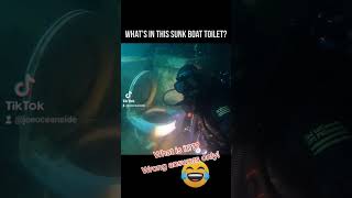 Clogged toilet in sunken boat