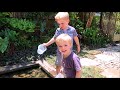 Nature play kids: Releasing and catching guppies