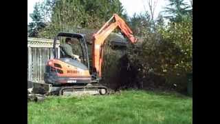 Track Hoe Excavating Removing Hedge To Excavate Trench (Day 1 New Home Construction)