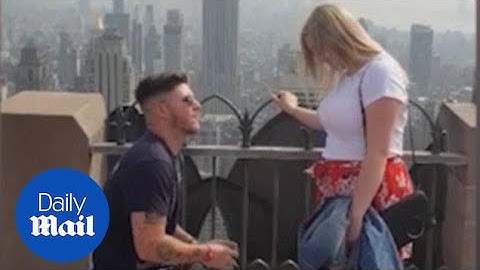 Couple get engaged in NYC despite being scammed by taxi driver