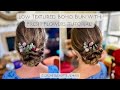 Securing Fresh Flowers in Gorgeous Low Textured Boho Bun Bridal Hairstyle Tutorial!