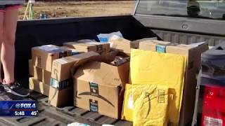 Neighbors deliver dozens of Amazon packages found dumped in Justin