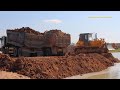 Hyundai trago 25.5ton dump trucks dumping soil & Komatsu D58P bulldozer pushing soil