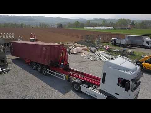 Video: Cos'è un camion a caricamento laterale per un container?