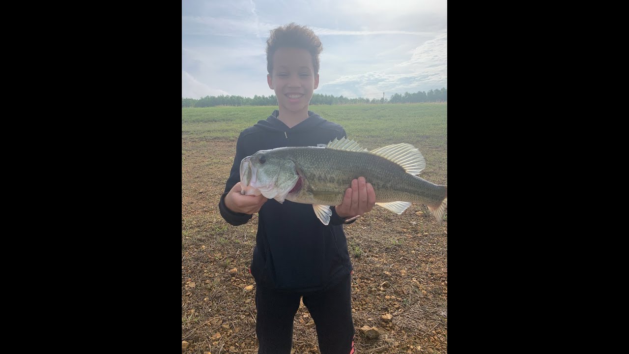 SHORT VIDEO OF SOME BASS FISHING! MY SON GETS ON SOME BIG BASS!!