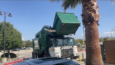 Waste management Amrep Autocar front loader doin some trash.