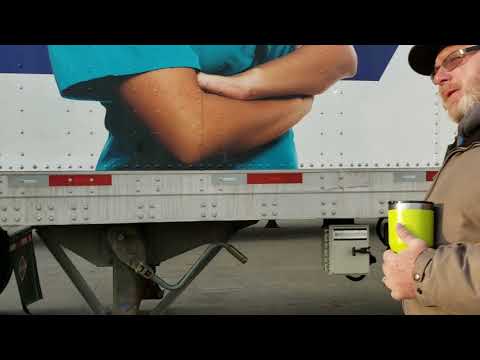 Mechanic inspecting car steering system