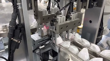 Aerosol cap assembly machine