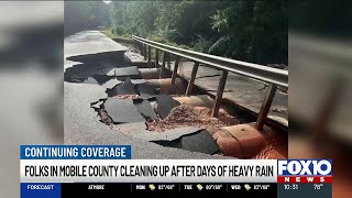 Communities clean up after days of heavy rain cause serious flood damage in Mobile County