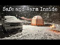 Snow storm camping in an inflatable tent w heavy snow