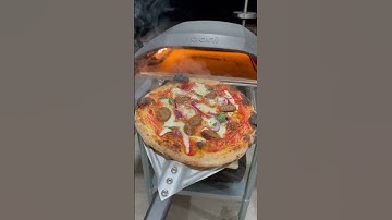 Meatball and onion pizza cooked in the @OoniHQ Koda 16.