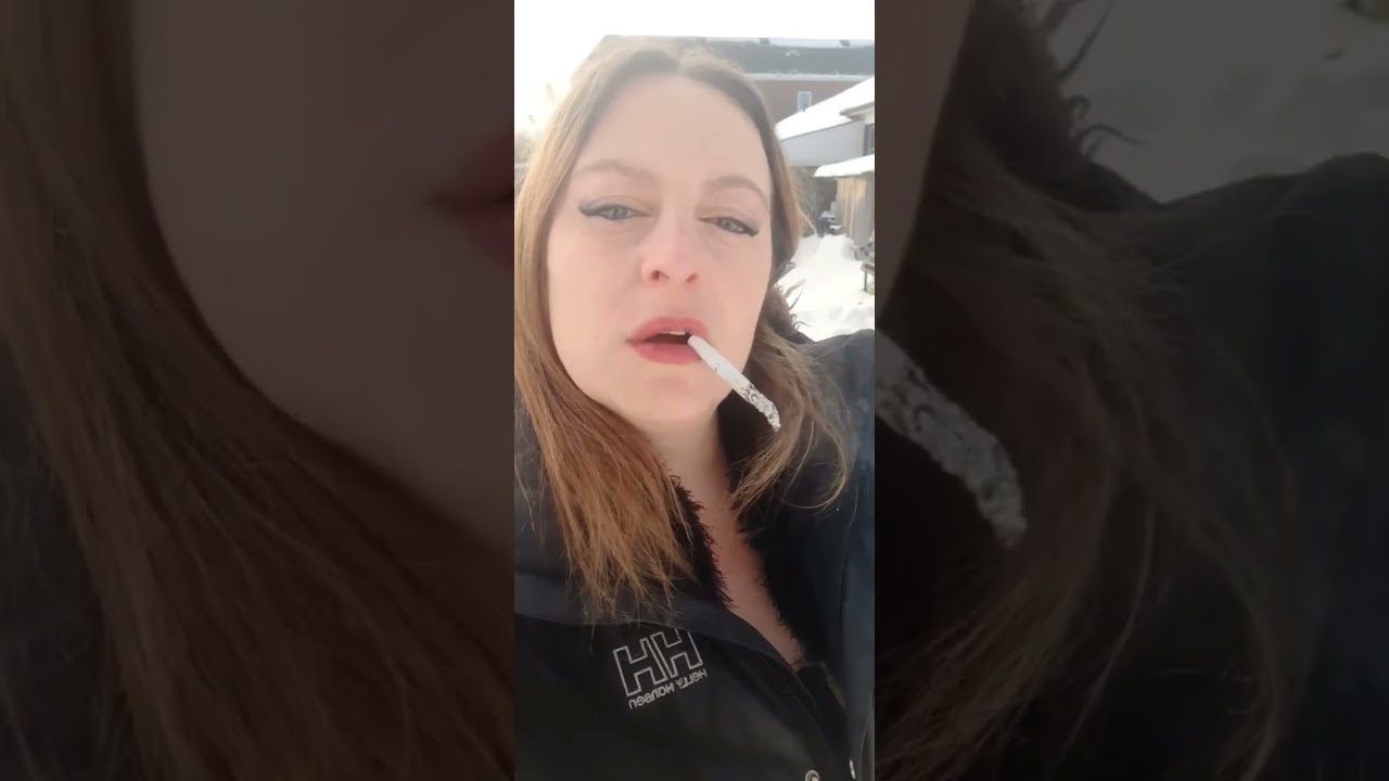 dangling a cigarette and nose exhale