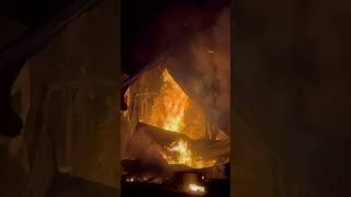 House fire heavily engulfed in flames.