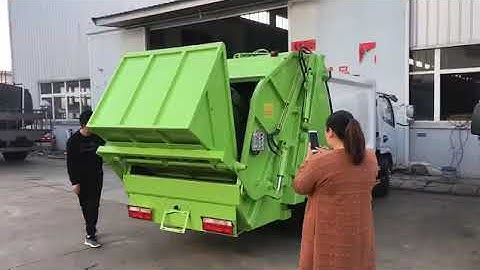 Compactor Refuse Truck: Rear Container Lifting Operation in Action!