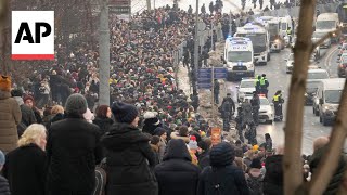 Alexei Navalny buried in Moscow as thousands attend funeral
