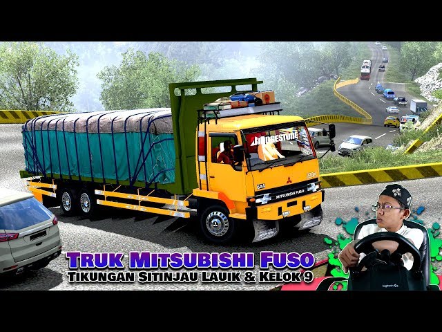 Truk Mitsubishi Fuso melewati Kelok 9 dan Sitinjau Lauik class=