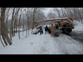 Snow Plow stuck  in deep snow off of road. Fork lift nearly tips over. Off road recovery