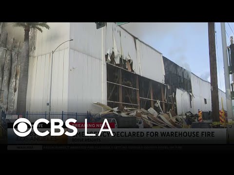 Smoke continues to grow Sunday morning from the Boyle Heights warehouse fire