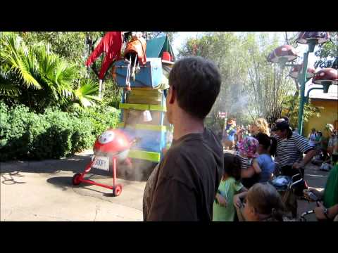 Tommy high fives Baloo and other Disney Characters