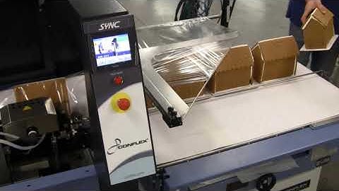 Conflex SYNC side sealer shrink wrapper running Gingerbread Houses