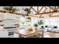 Modern kitchen, white cabinets, wooden ceiling beams, white subway tile backsplash, stainless steel